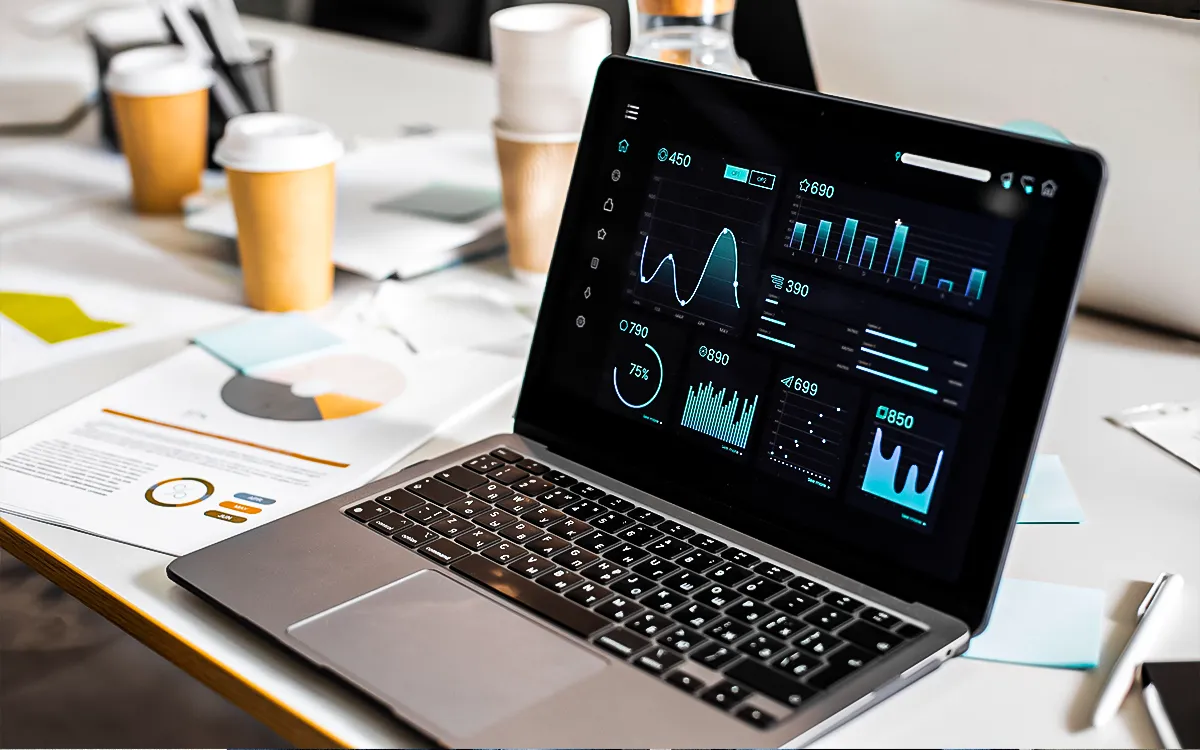Flat illustration of a laptop </p> <p>showing an automated dashboard or investment graph